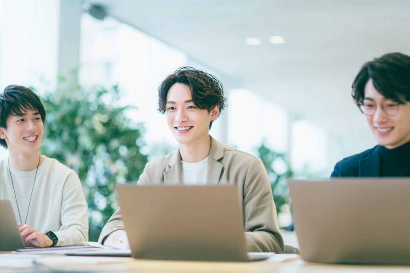 Three friends collaborating at a table Three friends collaborating at a table